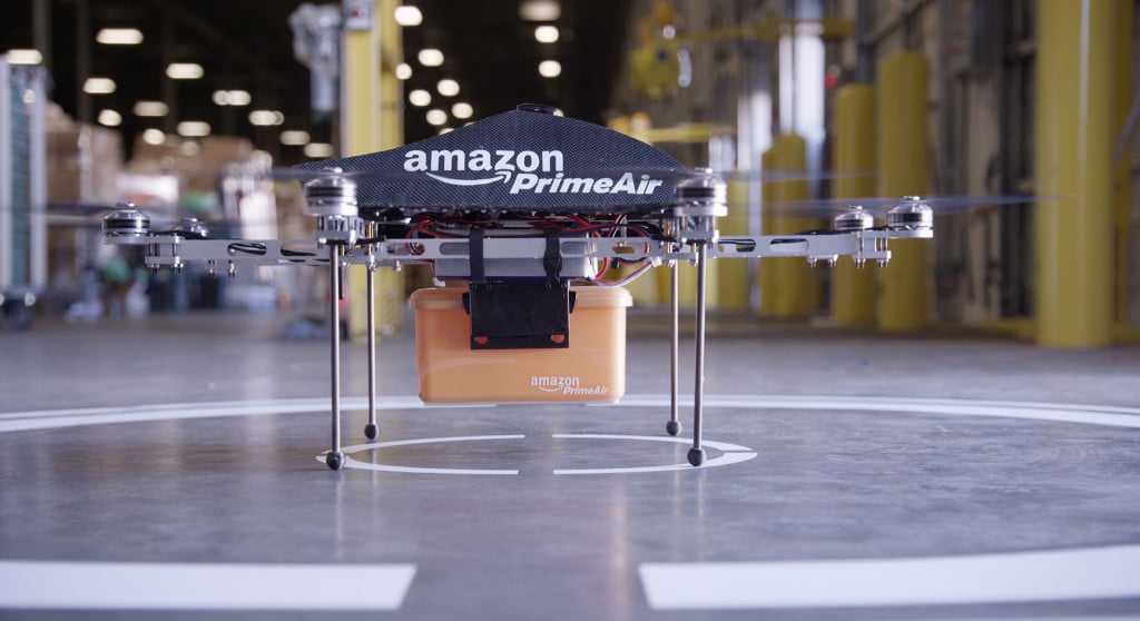 Amazon Prime Air Drone with package in an Amazon warehouse facility just before takeoff for delivery.