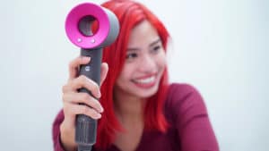 Girl using Dyson Supersonic